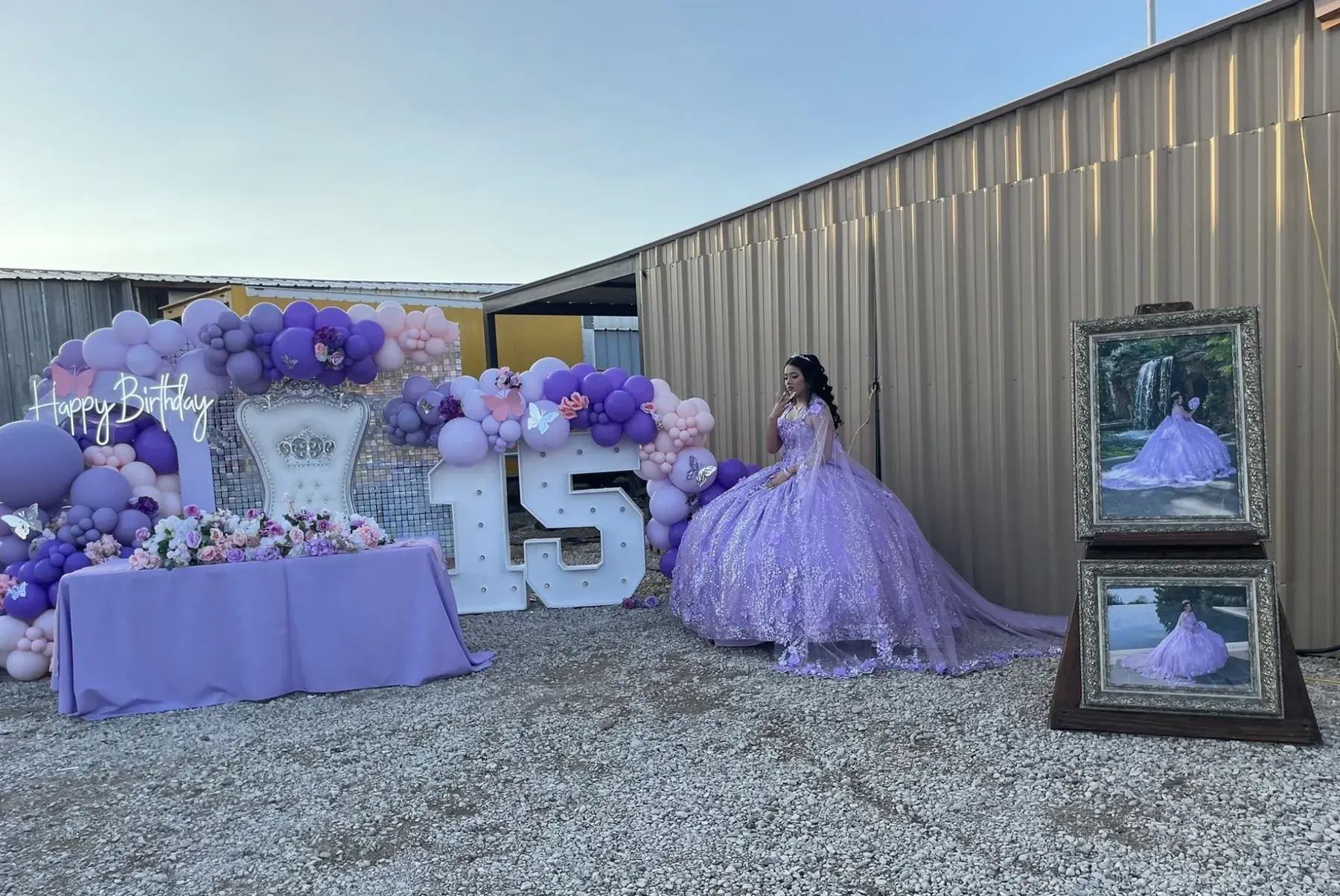 Quinceañera in a purple gown beside her fifteenth-birthday display at Rancho 3 Palomas